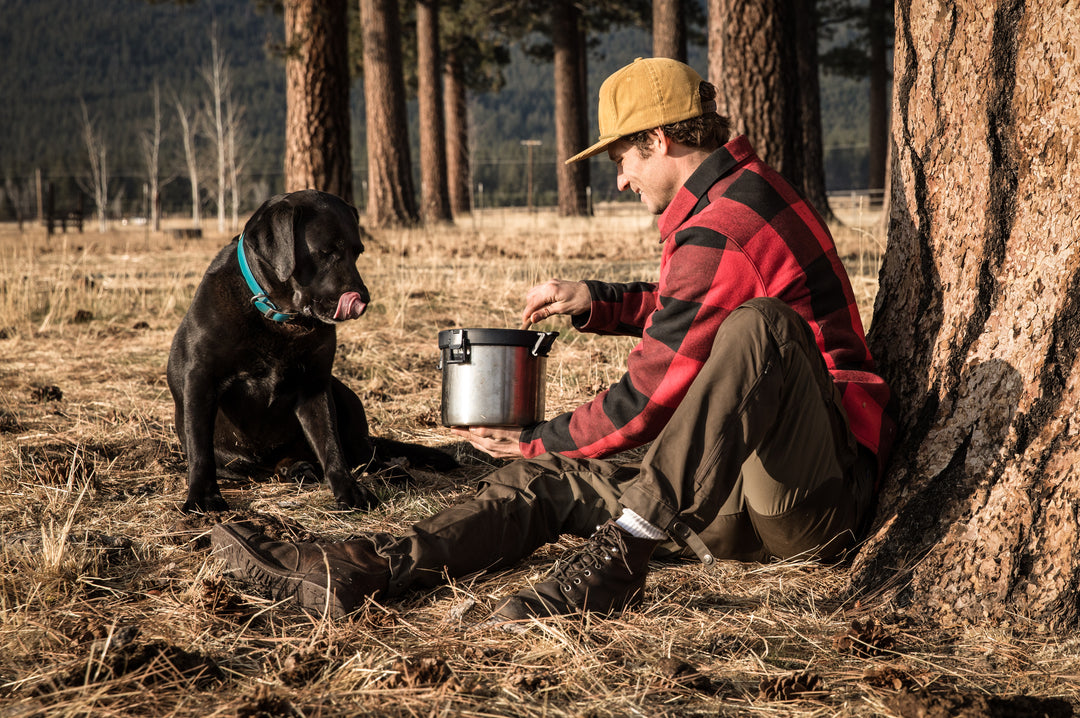 Man with his dog in the woods