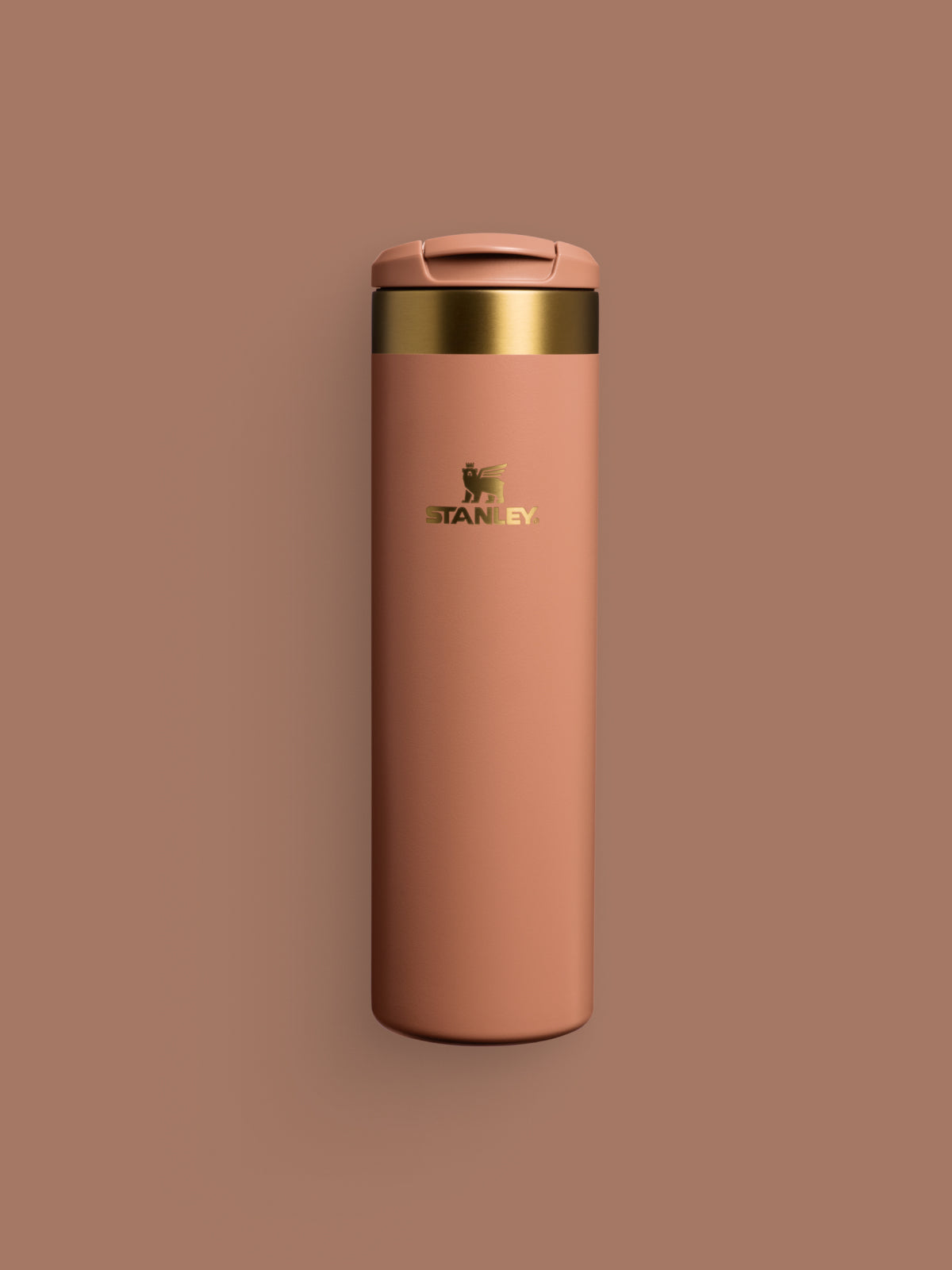 Stanley Fall Collection Aerolight Water Bottle in Mocha Latte Brown with gold accents on a brown backdrop