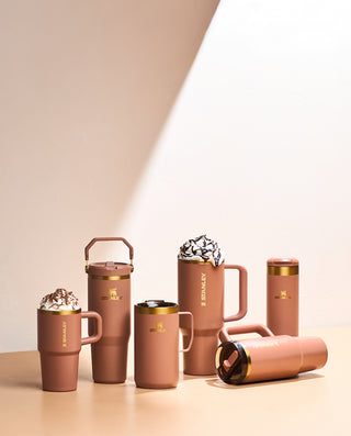Stanley Fall Collection drinkware in Mocha Latte Brown, featuring mugs, tumblers, and bottles with gold accents on a neutral backdrop