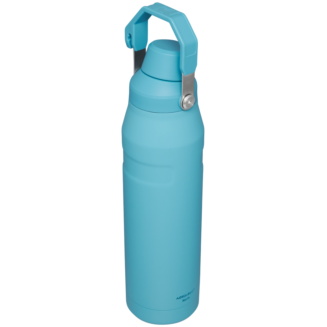 Premium Photo  Cold water in a plastic bottle with a blue cap on